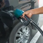 Man refueling black car gasoline 260nw